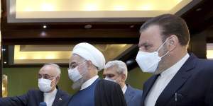 President Hassan Rouhani,second right,listens to head of the Atomic Energy Organization of Iran Ali Akbar Salehi while visiting an exhibition of Iran’s new nuclear achievements in Tehran,Iran. 