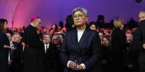 Foreign Affairs Minister Penny Wong places candle during a ceremony marking the 80th anniversary of the liberation of Auschwitz in Poland. 