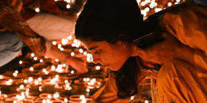 Candles on the banks of the Saryu River during India’s Diwali Festival.