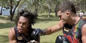 Nathan Cleary punches Penrith teammate Jarome Luai.