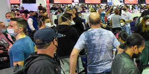 Qantas passengers queuing at Sydney Airport for a flight to New Zealand. 