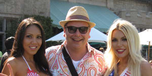 Andrew Hornery,centre,with Miss Playboy Brazil,left,and Crystal Hefner at the Playboy Mansion July 4 party in 2013.