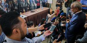 Muhammad Shafee Abdullah,lead lawyer for former Malaysia prime minister Najib Razak,right,speaks to media outside court on Wednesday.