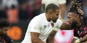 England’s Ollie Lawrence consoles Fiji’s Waisea Nayacalevu.