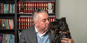 Michael Tiyce,pictured with his schnauzer Ferdinand,said the family law changes applied to all current court disputes except those at the stage of a final hearing.