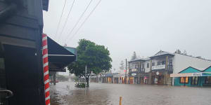 Major flood tops Lismore CBD levee again as Sydney records wettest March on record