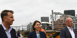 Transport Minister Andrew Constance,left,Premier Gladys Berejiklian and Sydney Metro chief executive Jon Lamonte inspect work at Central Station on Monday.