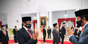 Sandiaga Uno,left,with Indonesia President Joko Widodo.