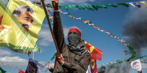 A Kurdish man holds up a picture of PKK leader Abdullah Ocalan in Diyarbakir,Turkey,in March 2015.