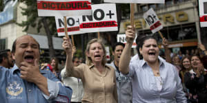 Venezuelans take to streets in walkout to push Maduro out