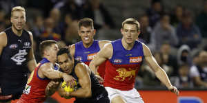 Eddie Betts is tackled by Dayne Zorko of the Lions on Saturday.