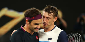 John Millman,right,congratulates Roger Federer after their third-round showdown at the 2020 Australian Open.