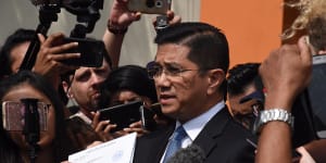 Mohamed Azmin Ali has been accused of appearing in a leaked sex tape - a claim he denies. 