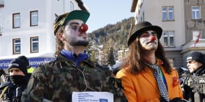 Protesters in clown outfits demonstrate against the World Economic Forum in Davos,Switzerland.