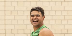 Latrell Mitchell heads into South Sydney training on Tuesday all smiles.
