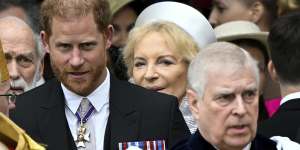 Prince Harry and Prince Andrew leave Westminster Abbey following the coronation.