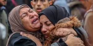 People mourn as they wait to collect the bodies of friends and relatives killed in an airstrike on December 25,2023 in Khan Yunis,Gaza.