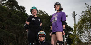 Inner West Roller Derby members Teigan Butchers (player name:Rainbow Smash),left,Dilys Norrish (player name:Flower Power),centre,and Aja Cordner (player name:Vicious D’Licious).
