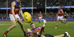 Harry McKay of the Blues and Brisbane’s Mitch Robinson collide.