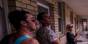 Residents in Dee Why are seen assessing the damage to an apartment block after a “microburst”,a severe storm downdraft often with winds exceeding 100kph ripped roofs off and uprooted trees from Dee Why to Narrabeen. 