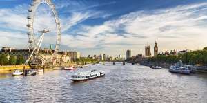 London sights – Westminster,Big Ben and the London Eye with the Thames alongside.