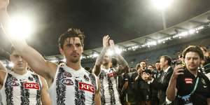 Collingwood captain Scott Pendlebury leads his teammates off the ground after the Magpies defeated Essendon.