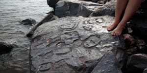 Ancient stone carvings on a rocky point of the Amazon River exposed after water levels dropped to record lows during a drought in Manaus,Brazil.