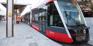 A tram being tested at a stop on High Street at Randwick.