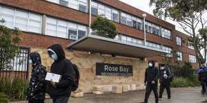 Cleaners arrive at Rose Bay Secondary College in Dover Heights on Tuesday after a student tested positive to COVID-19.