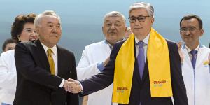 Factions:Then-acting President Kassym-Jomart Tokayev,right,and former Kazakh President Nursultan Nazarbayev shake hands in 2019. 