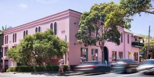 The rose-pink facade of Queens Court in Woollahra.