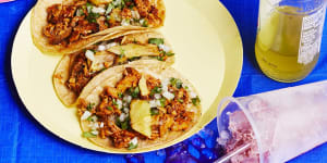 Tacos al pastor are served in double tortillas with finely chopped onion and coriander,freshly squeezed lime juice and spicy salsa.