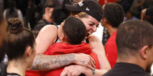 Cayla George celebrates her WNBA championship win with the Las Vegas Aces on Thursday.