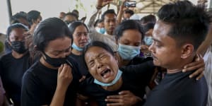 Mourners weeping at the funeral for a protester in Mandalay in February,2021. Witnesses said the military shot at mourners at a funeral in Yangon on Sunday. 