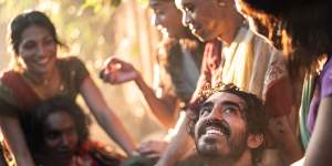 Dev Patel as Kid with the hijra community in Monkey Man. 