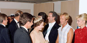 Queen Elizabeth II and the Duke of Edinburgh meet entertainers including Paul Hogan who performed in a 1980 Royal Charity Concert at the Opera House.