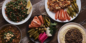 Eggs,sujuk,hummus,tabouli and pickles.