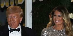 Former US president Donald Trump and former first lady Melania Trump arrive for a New Year’s Eve party at Mar-a-Lago,in Palm Beach.