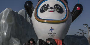 Workers clean the Beijing 2022 Winter Olympics mascot.