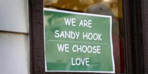 Message of support:The sign designed by Tim Stan has been popping up all over Sandy Hook.
