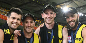 (L-R) Trent Cotchin,Kane Lambert,Dylan Grimes and Shane Edwards celebrate with the 2020 premiership cup. 