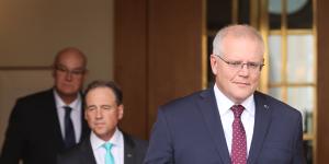 Prime Minister Scott Morrison and Health Minister Greg Hunt address the media in February about their vaccination strategy.