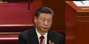 Chinese President Xi Jinping applauds during the opening session of the National People’s Congress. 