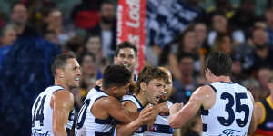 Geelong's Tom Atkins celebrates a goal against Adelaide with teammates on Thursday night.