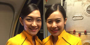 Nok Air's all-female crew wear sunny yellow uniforms.