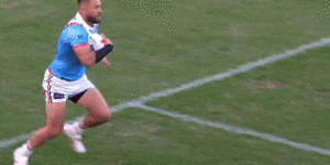 Moses Suli takes a brutal hit from Jared Waerea-Hargreaves just after kick-off in the Anzac Day clash.