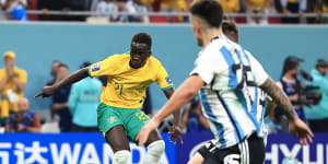 Garang Kuol is denied by Argentina goalkeeper Emiliano Martinez at the World Cup in 2022.