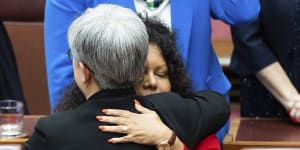 Labor’s leader in the Senate,Penny Wong,and Assistant Minister for Indigenous Australians Malarndirri McCarthy embrace after the Constitution Alteration Bill passed the Senate on Monday.