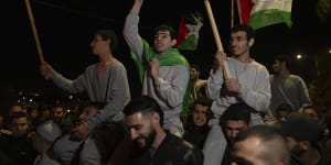 Former Palestinian prisoners who were released by Israeli authorities fly Palestinian and Hamas flags.