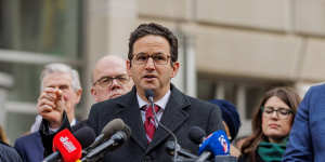 Senator Brian Schatz,a Democrat from Hawaii,speaks outside the USAID headquarters in Washington,DC.